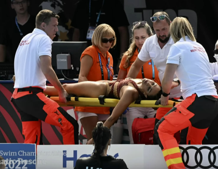 Anita Alvarez on stretcher with EMTs.